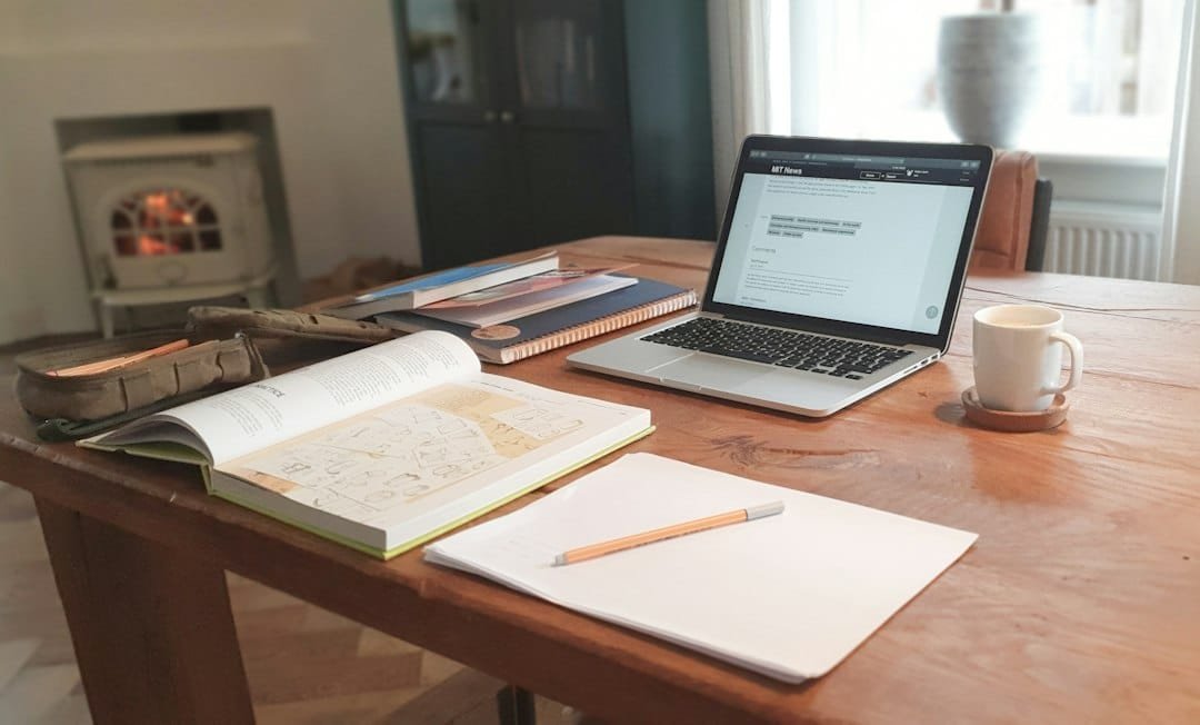 Competitive exam preparation with books and laptop