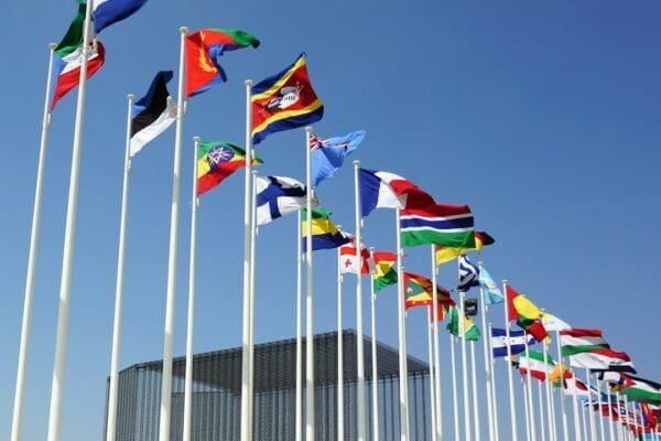International flags at a diplomatic summit representing BRICS cooperation