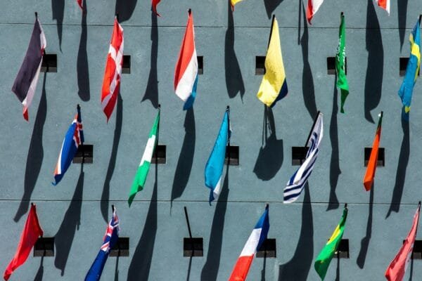 International flags representing BRICS cooperation at a global summit