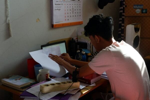 Student preparing current affairs notes for competitive examinations