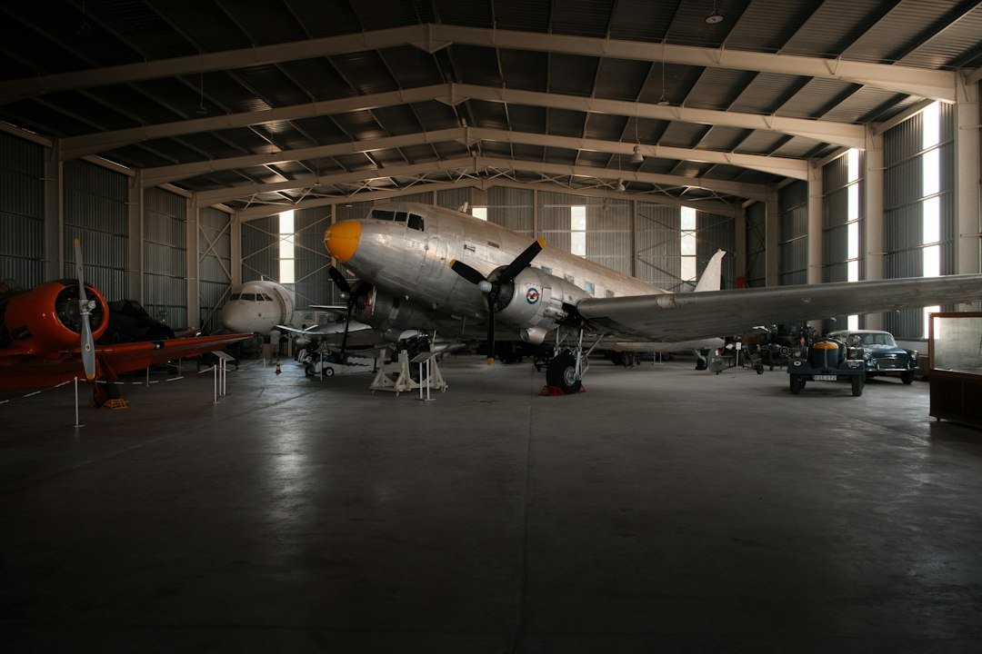 Aircraft displayed inside an industrial hangar representing aerospace research and technical training