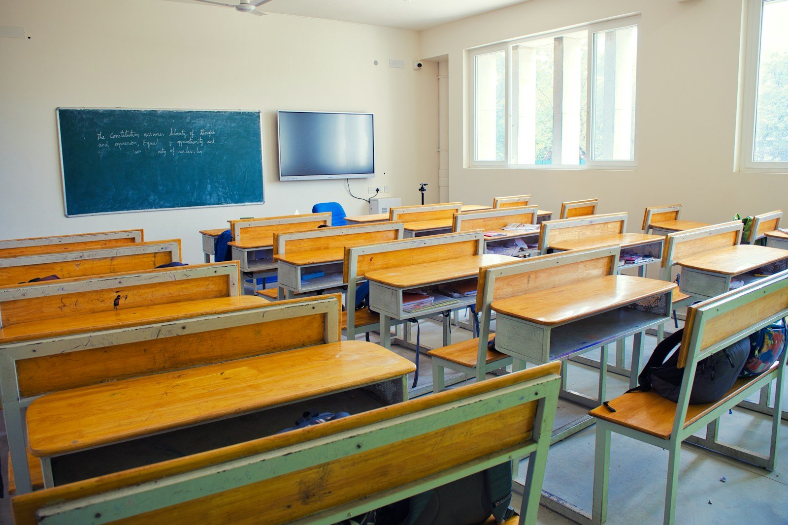 Students preparing for competitive examinations with books and study materials