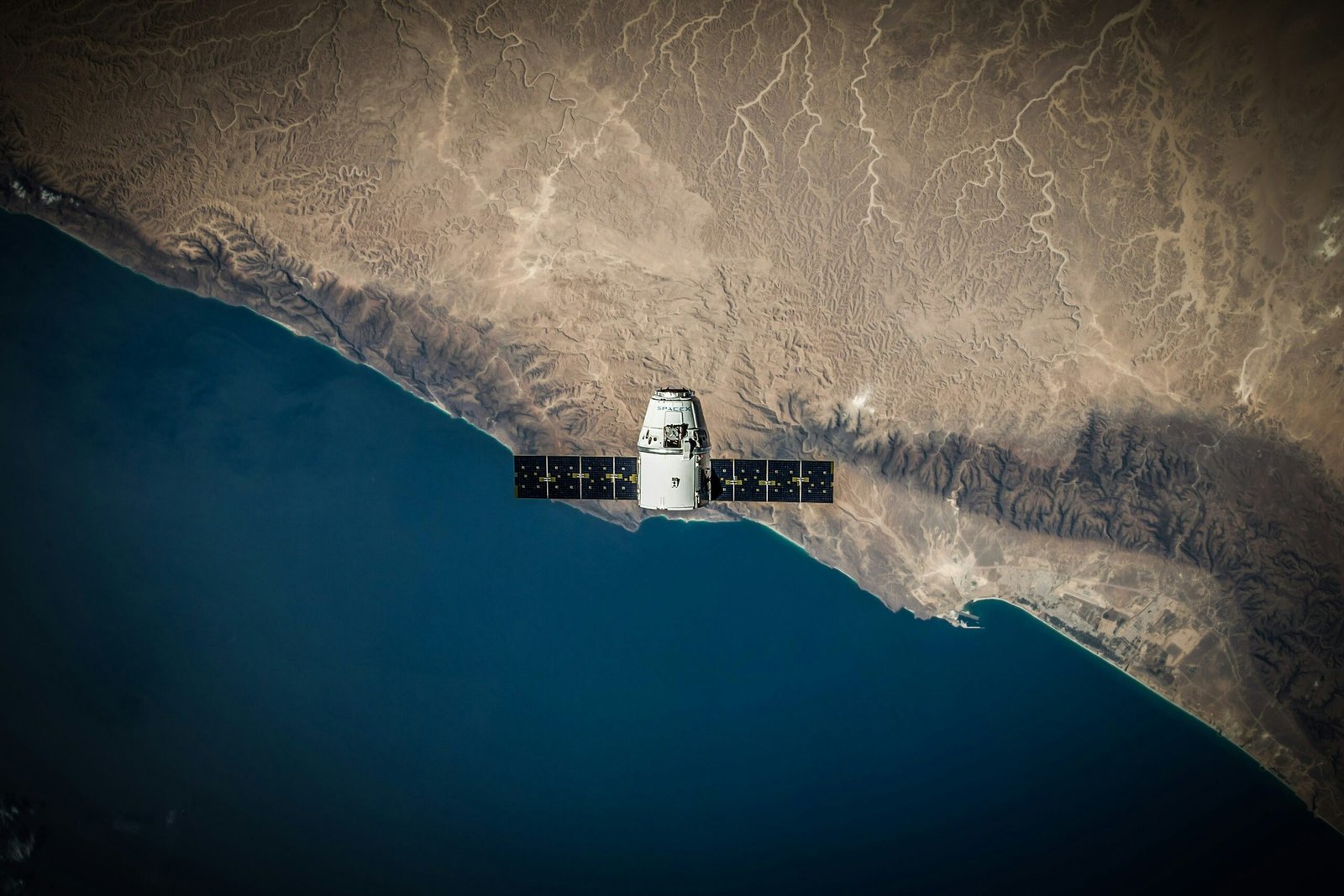 Earth observation satellite above the planet, illustrating remote sensing and space applications