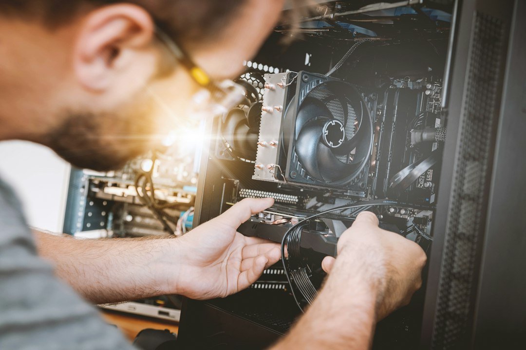 Computer hardware components being installed; illustrative image for the NIELIT Computer Hardware Maintenance Technician registration guide