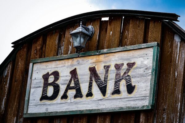 Local bank branch signage illustrating access to formal banking and financial inclusion