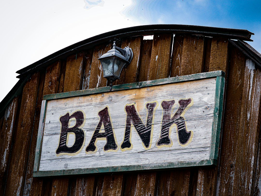 Local bank branch signage illustrating access to formal banking and financial inclusion