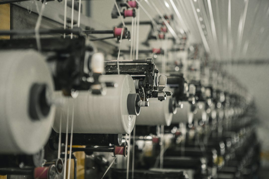 Industrial textile weaving machines illustrating the PLI Scheme for Textiles